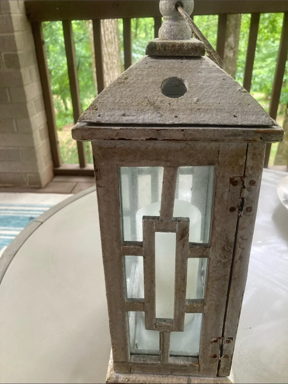 Wood and glass paned porch lantern with battery operated wax candle